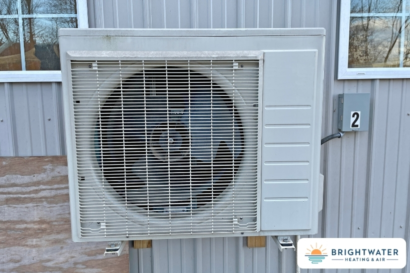Ductless mini-split outdoor unit installed on an exterior wall by Brightwater Heating & Air.