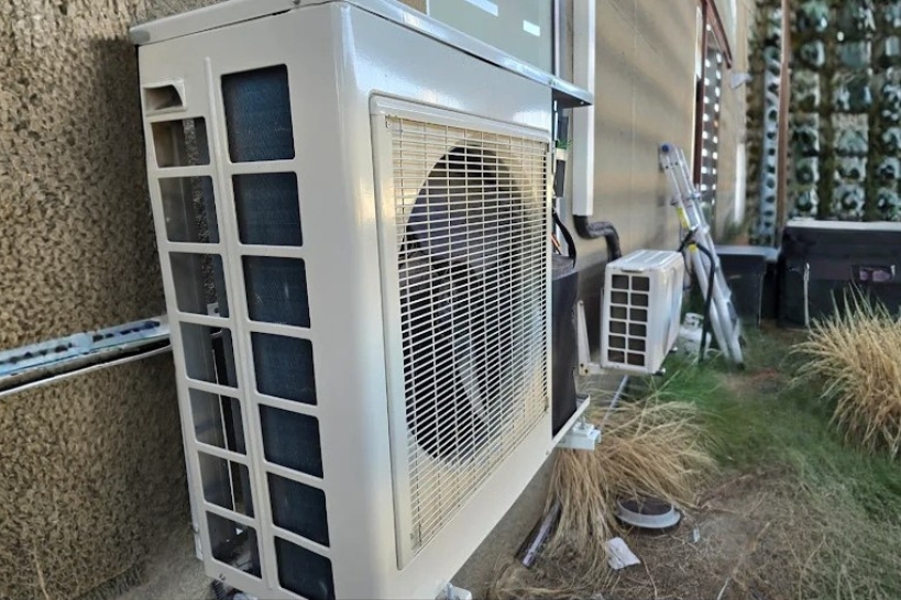Ductless mini-split outdoor units representing a comparison with central AC for Huntington Beach homes.